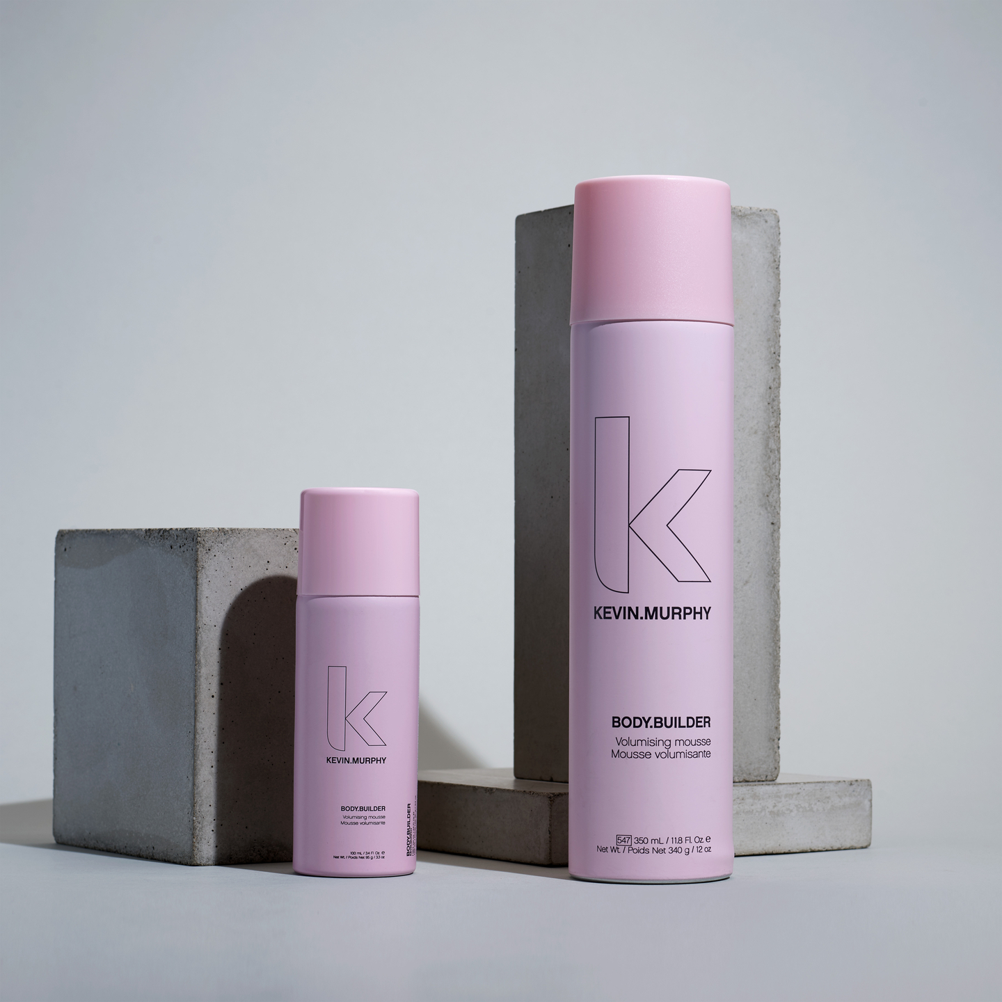 BODY.BUILDER volumizing mousse on a minimalist background.